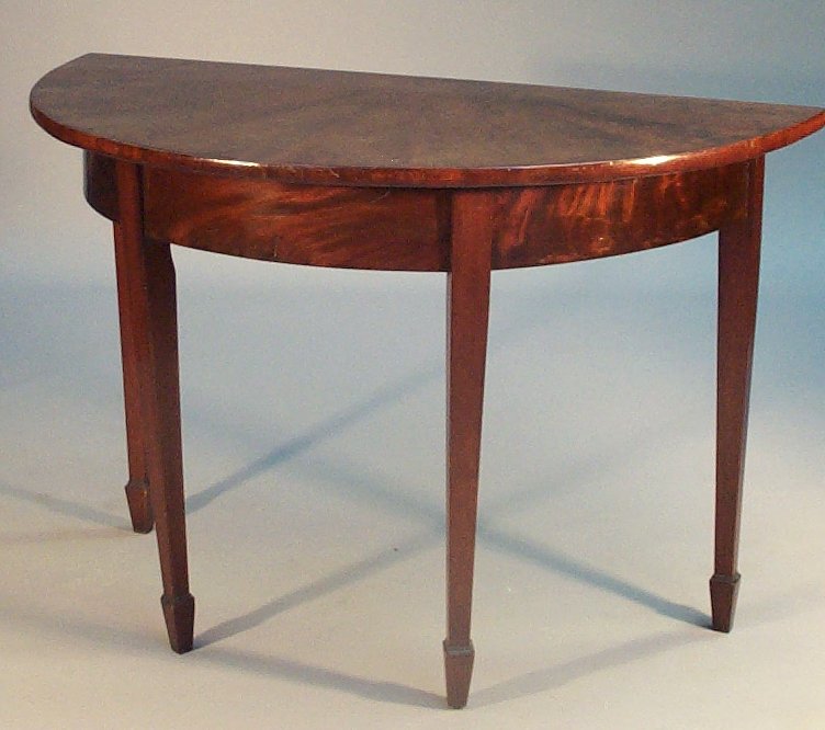 A George III mahogany demi lune table