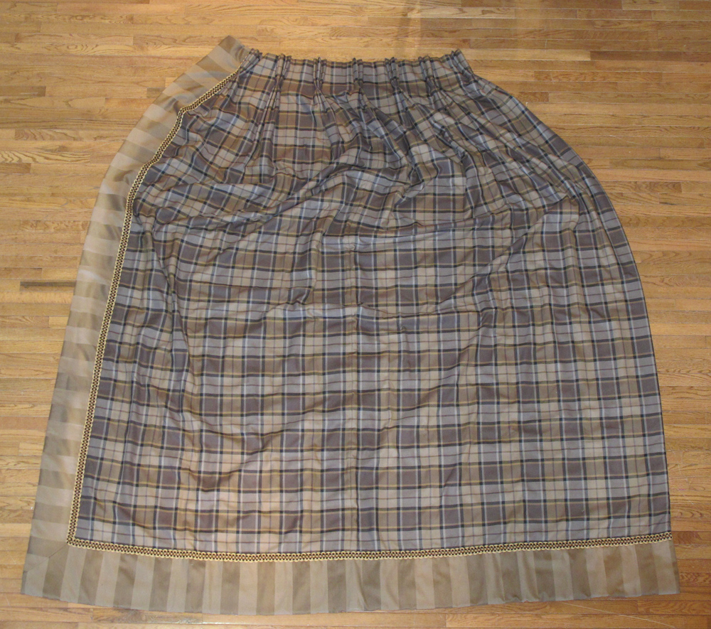 A pair of handmade brown tartan curtains