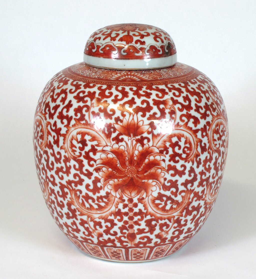 A late 19th century Chinese red painted ginger jar and cover
