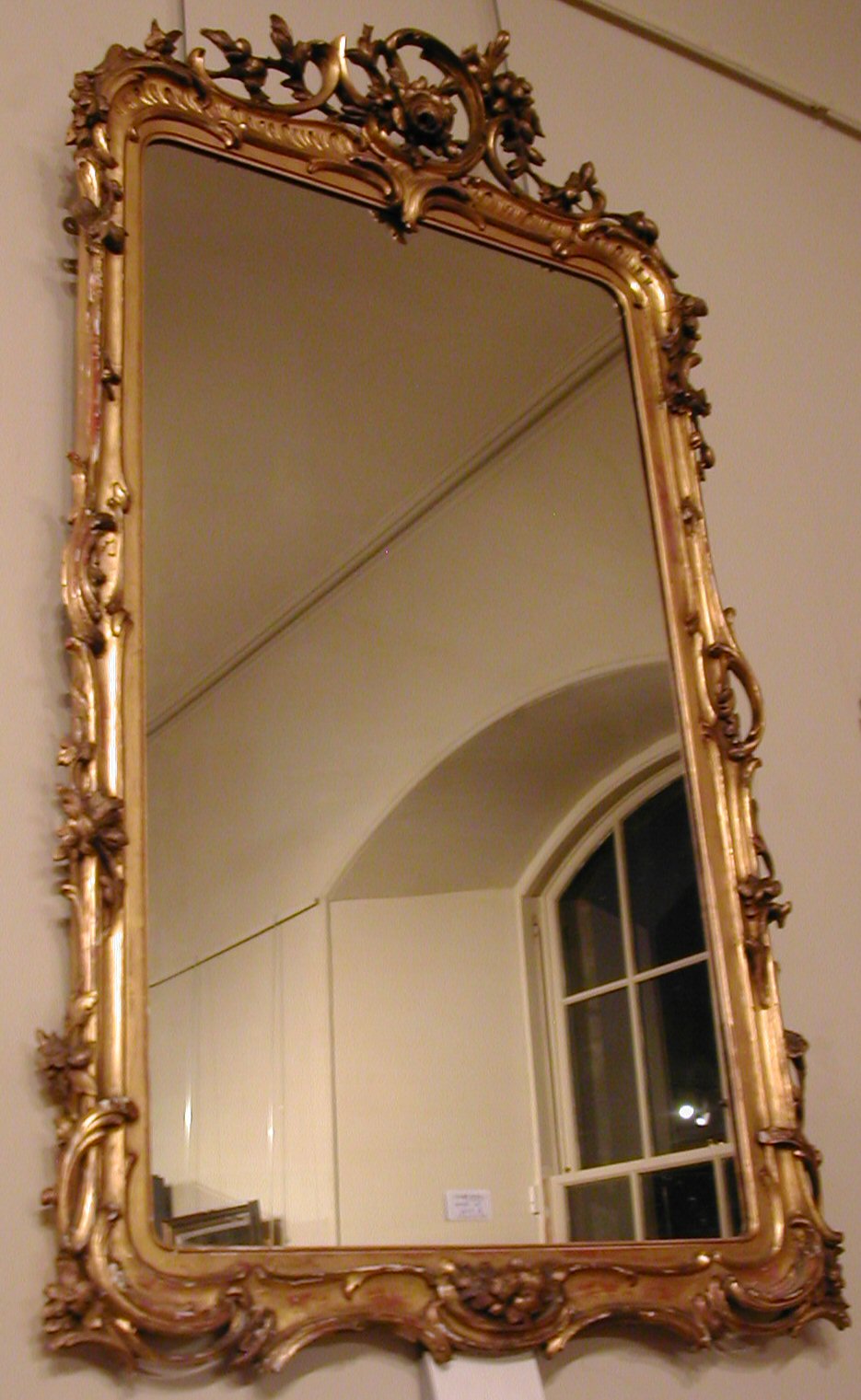 A Rococo-style giltwood mirror,