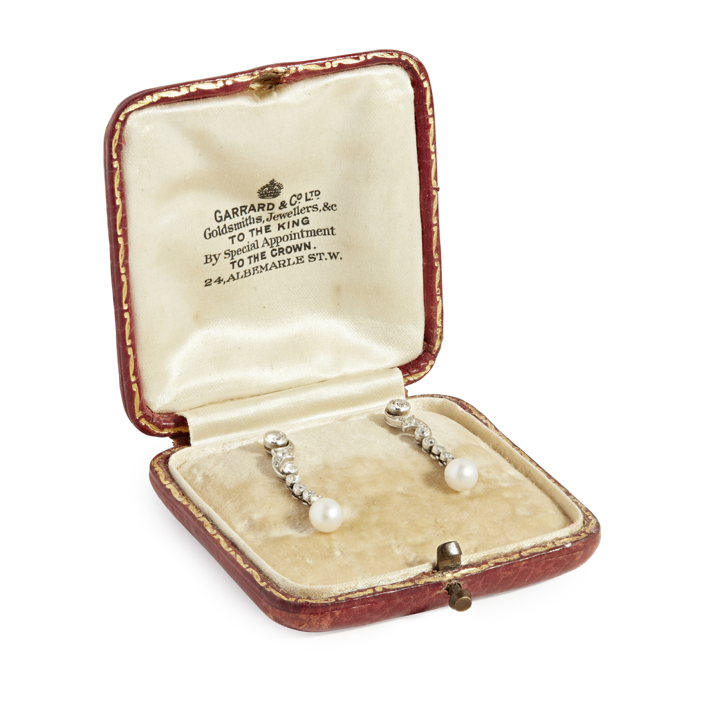A pair of pearl and diamond set pendant earrings