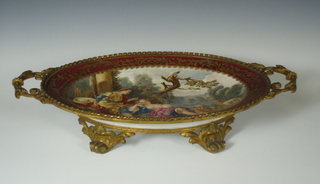 A Vienna style porcelain gilt metal mounted oval platter
