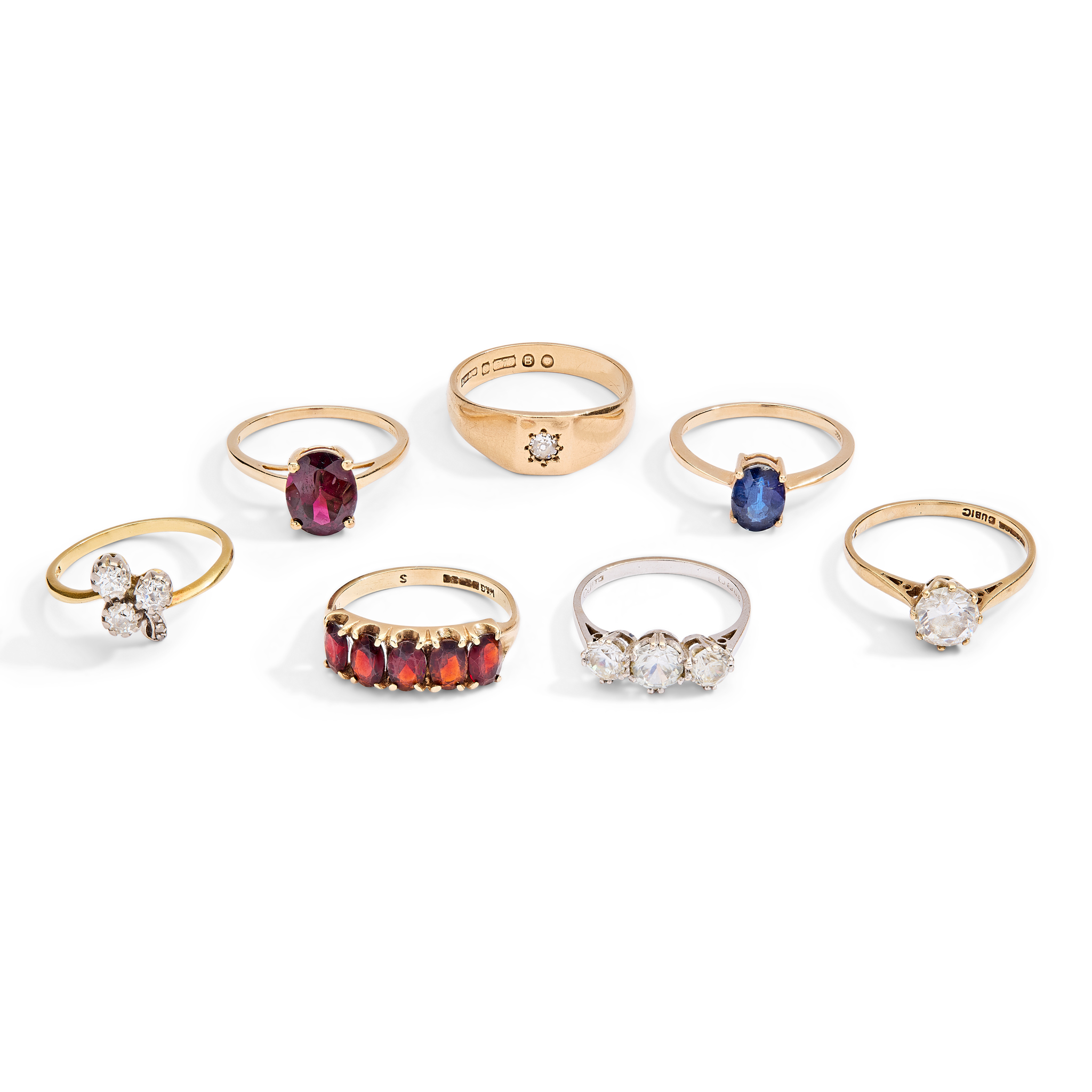 A collection of seven gem-set rings