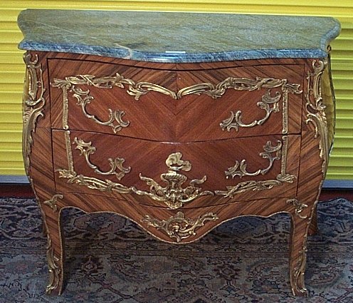A Louis XVI style kingwood quarter veneered bombe commode