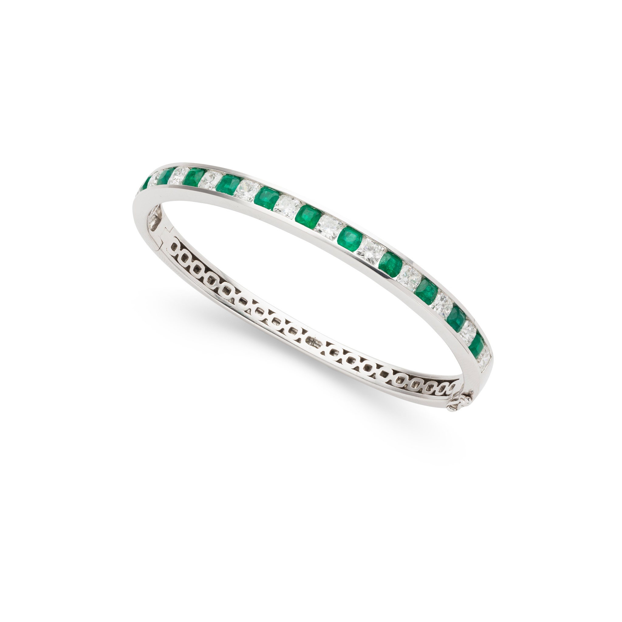 An emerald and diamond bangle