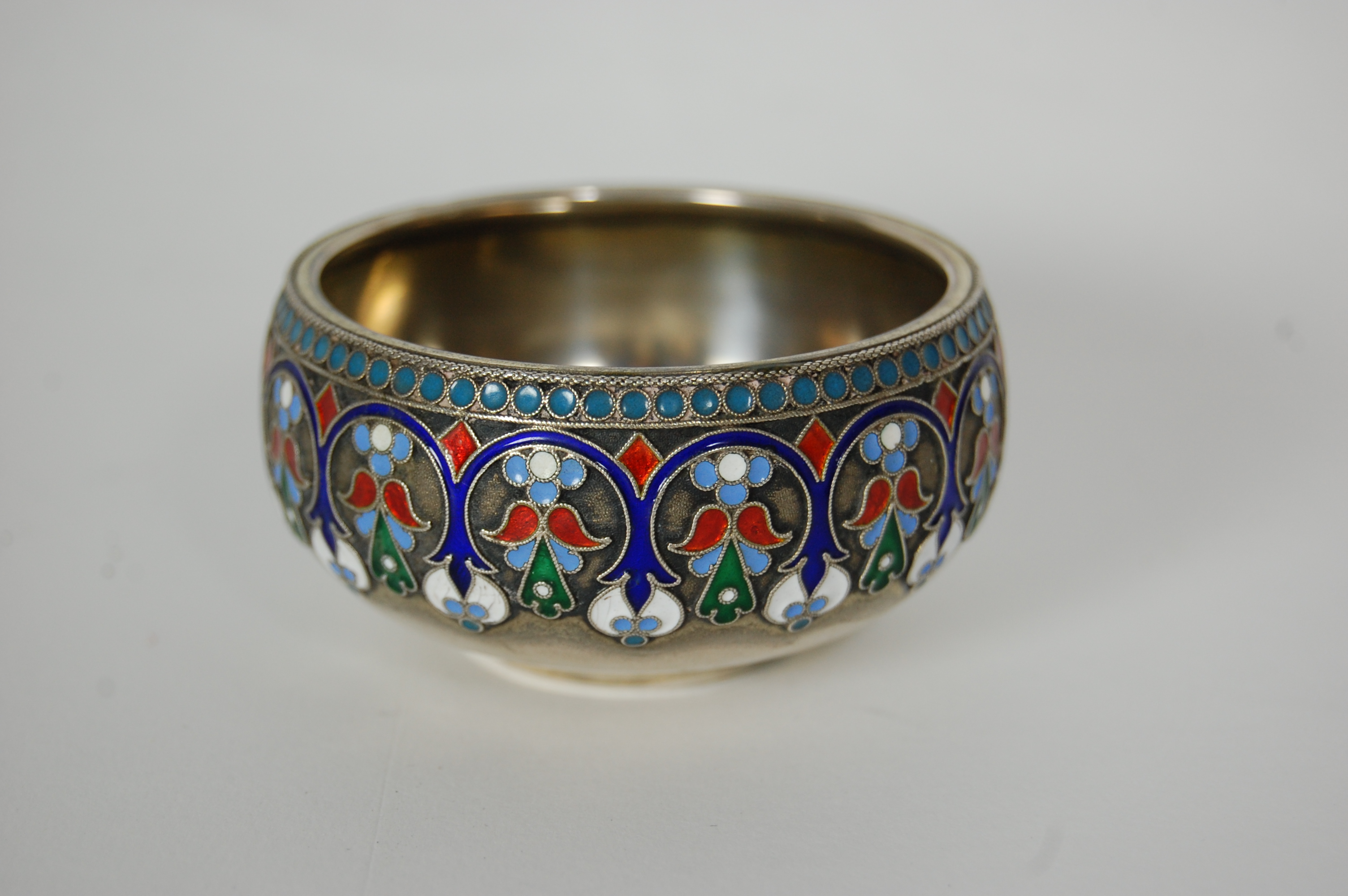 A Russian silver and champleve enamel salt