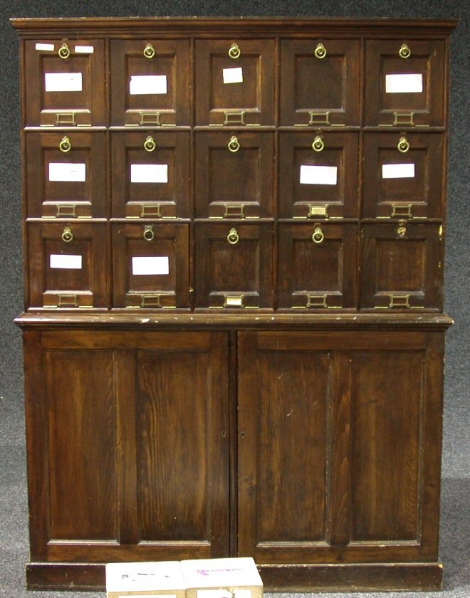 A stained beech deed box cabinet,