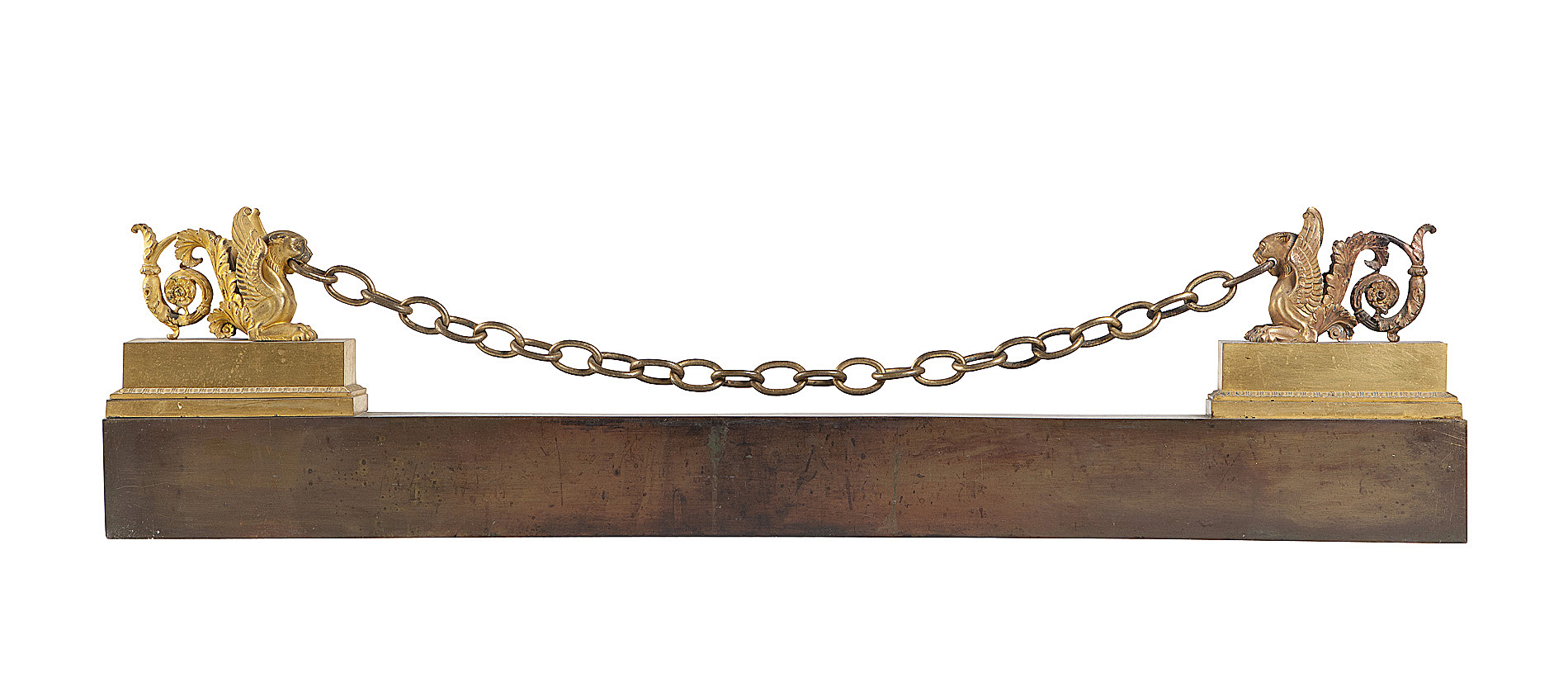 FRENCH EMPIRE STYLE PATINATED BRASS AND ORMOLU FENDER