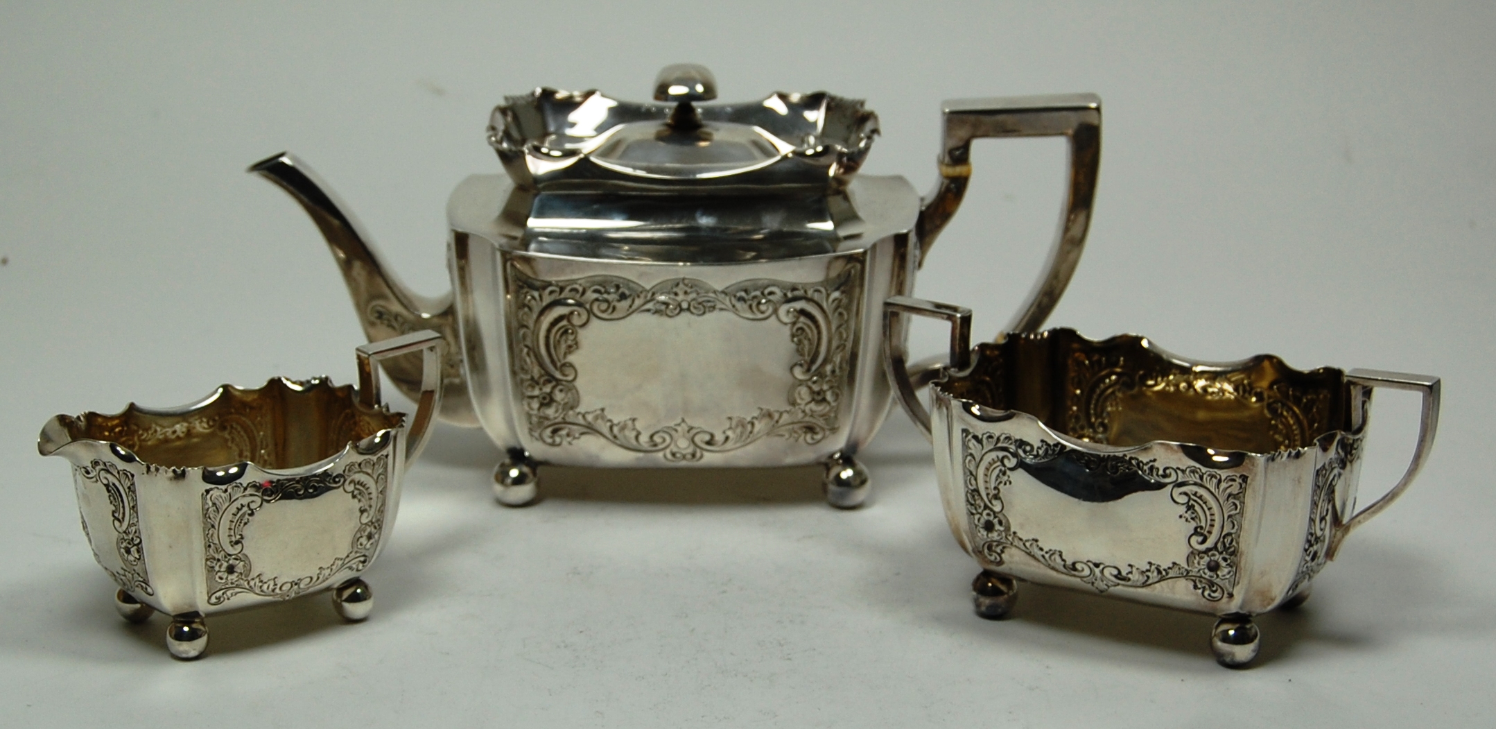 An Edwardian three piece tea set