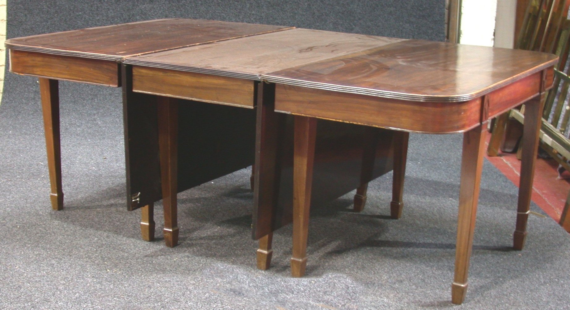 A Regency style mahogany dining table,