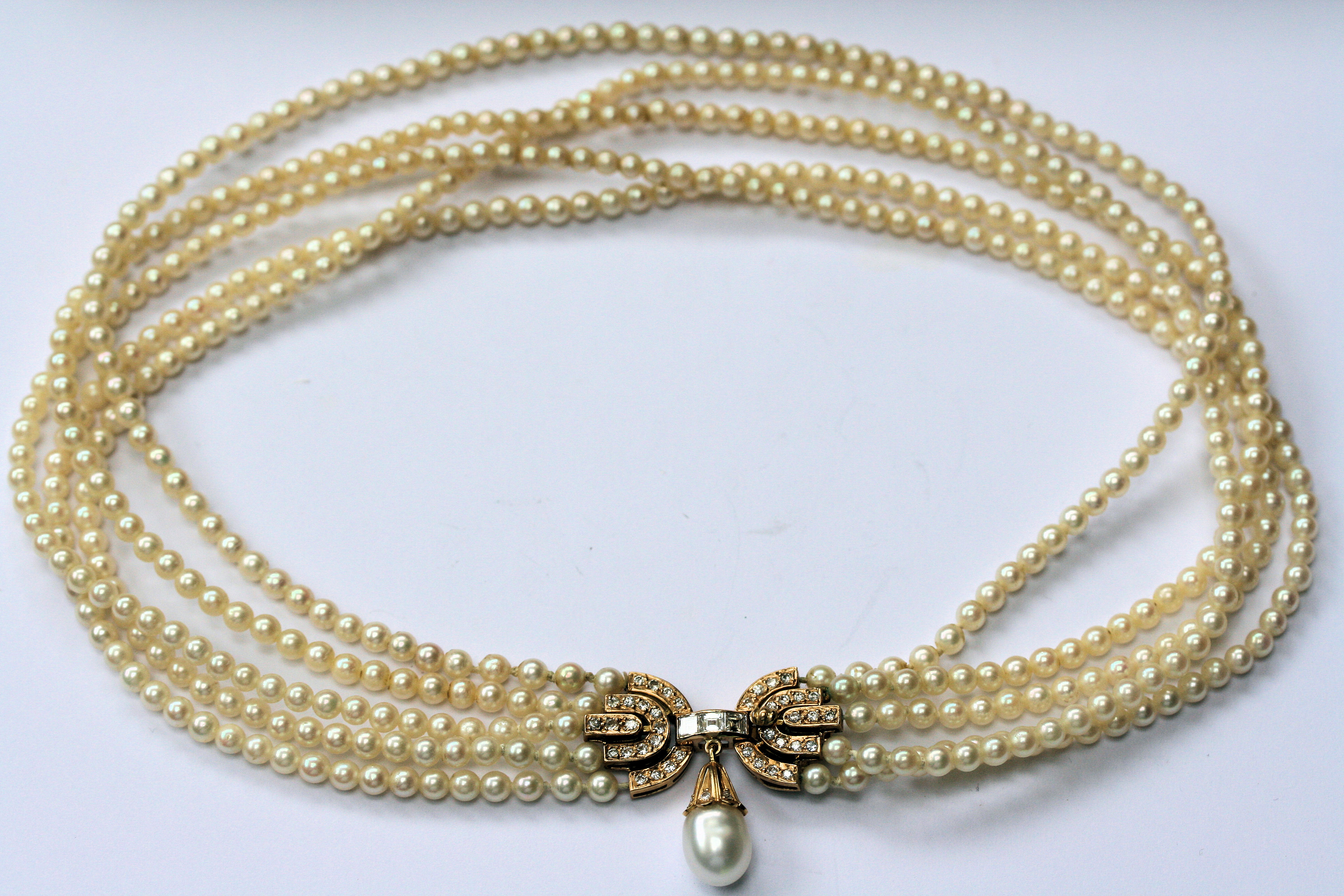 A five-row cultured pearl necklace with 18ct gold diamond set clasp