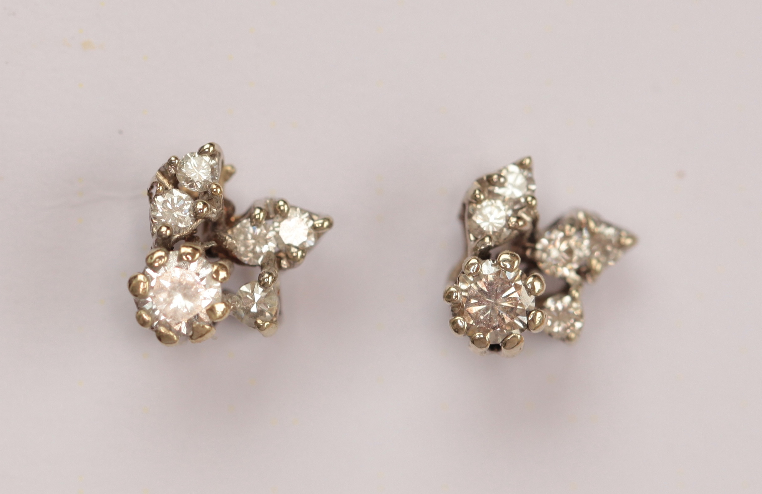 A pair of diamond cluster earrings