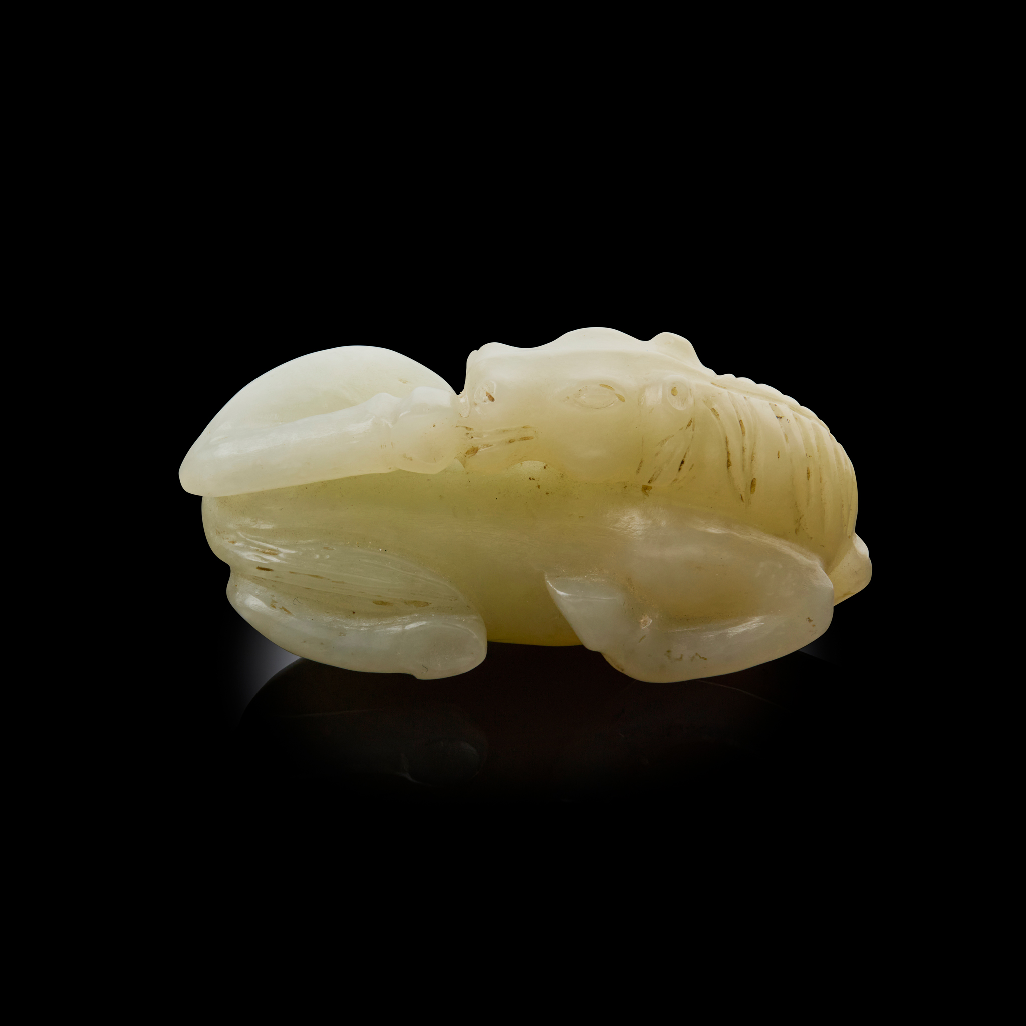 CHINESE PALE CELADON JADE CARVING OF A RECUMBENT HORSE
