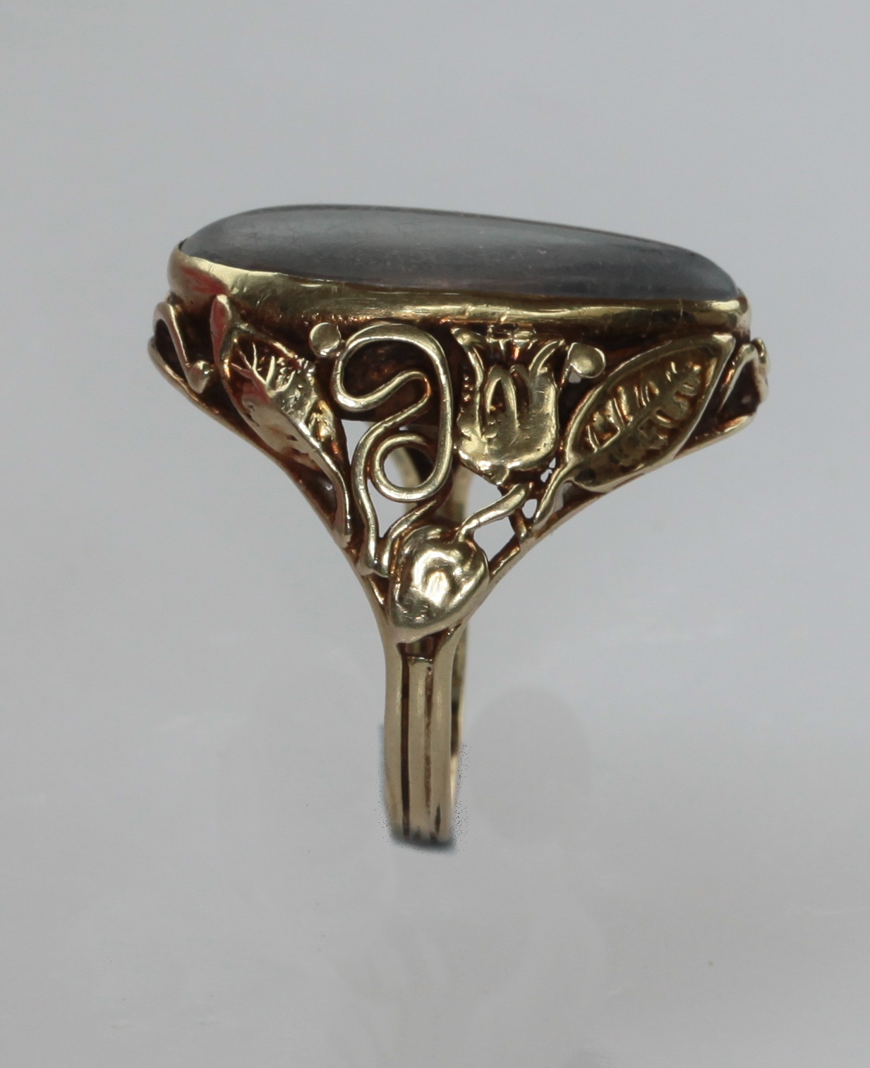 An Arts & Crafts style moonstone set ring