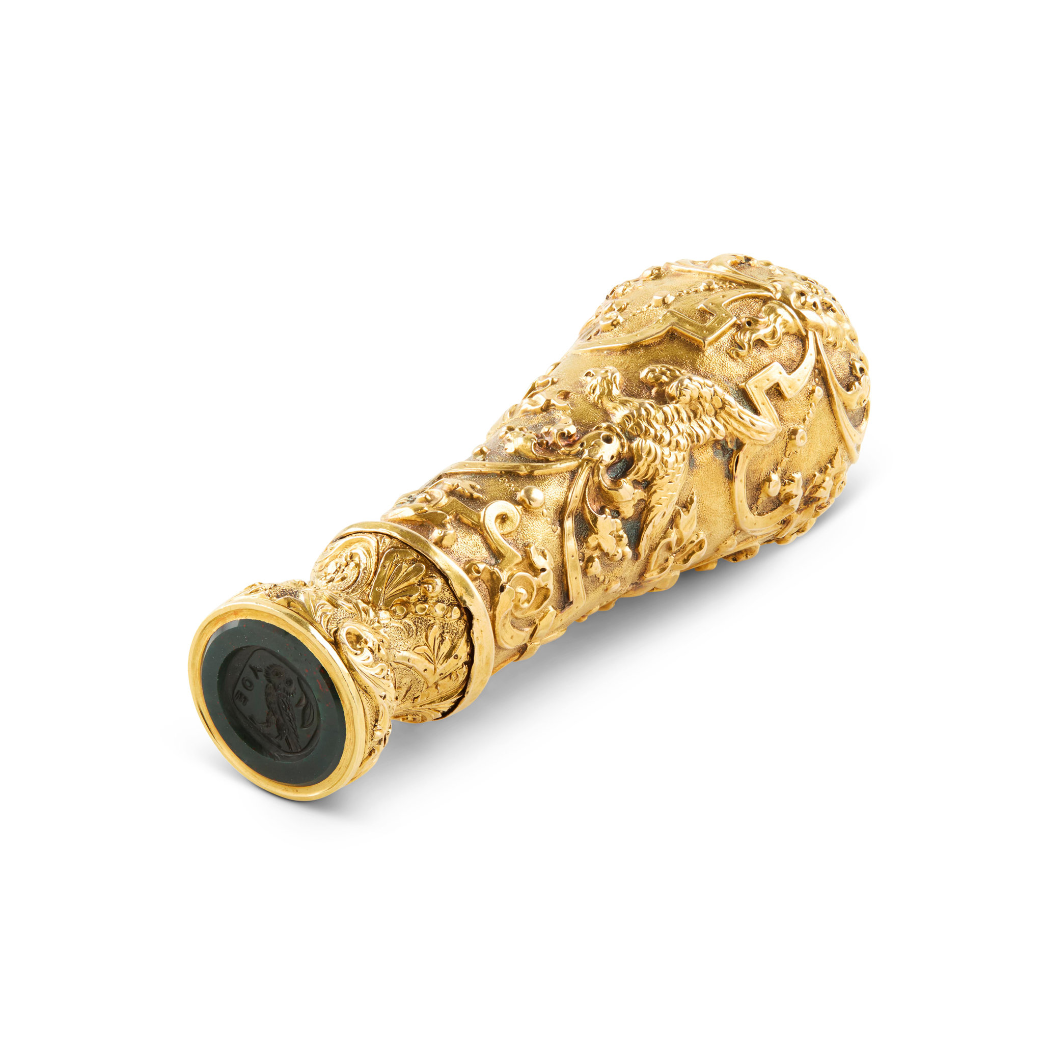 AN ORNATELY CHASED GOLD AND BLOODSTONE SEAL