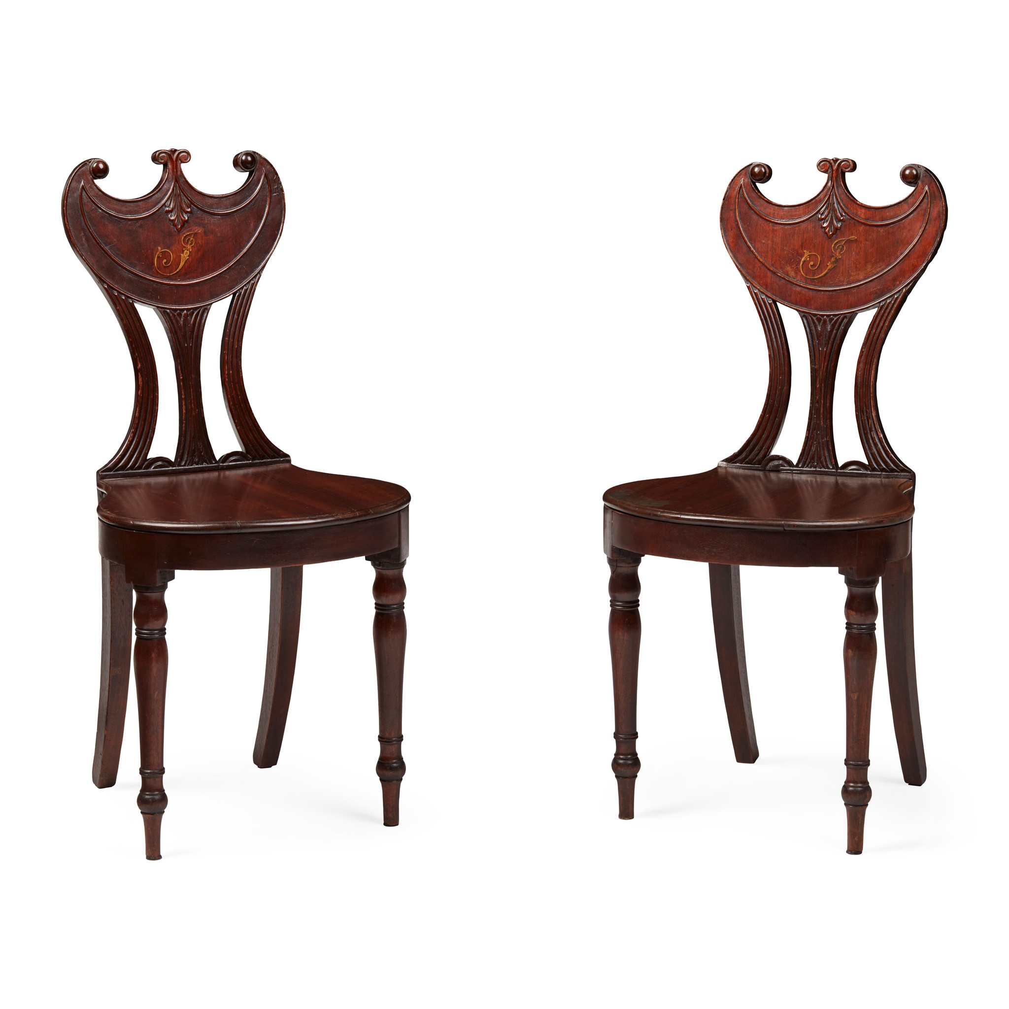 PAIR OF LATE GEORGE III MAHOGANY PELTA BACK HALL CHAIRS