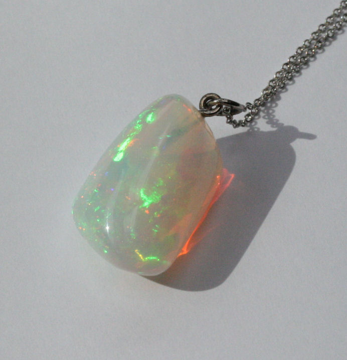 A white opal pebble set pendant with chain