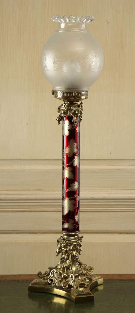 A large gilt brass and etched glass lamp