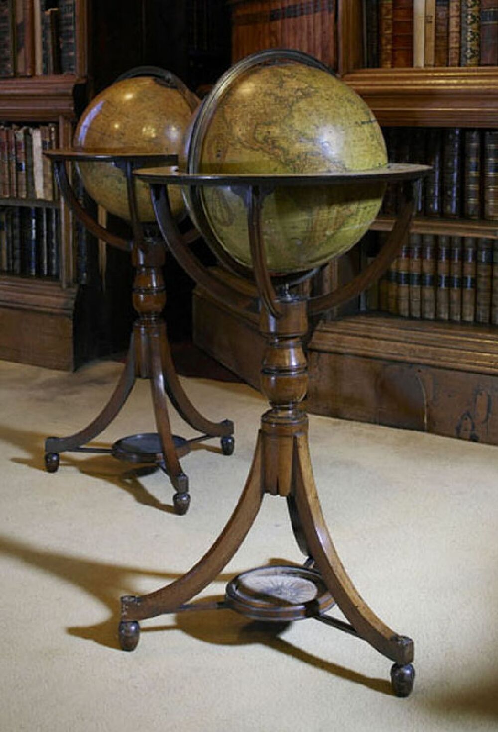 A pair of Newton's 'New Improved' terrestrial and celestial library globes circa 1830