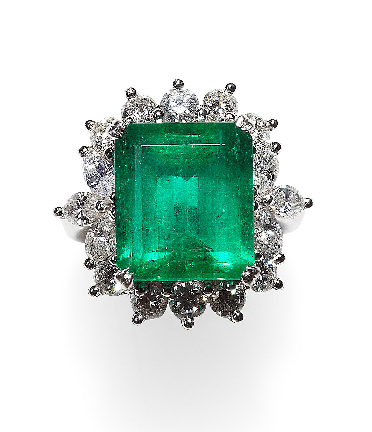 A modern emerald and diamond set cluster ring