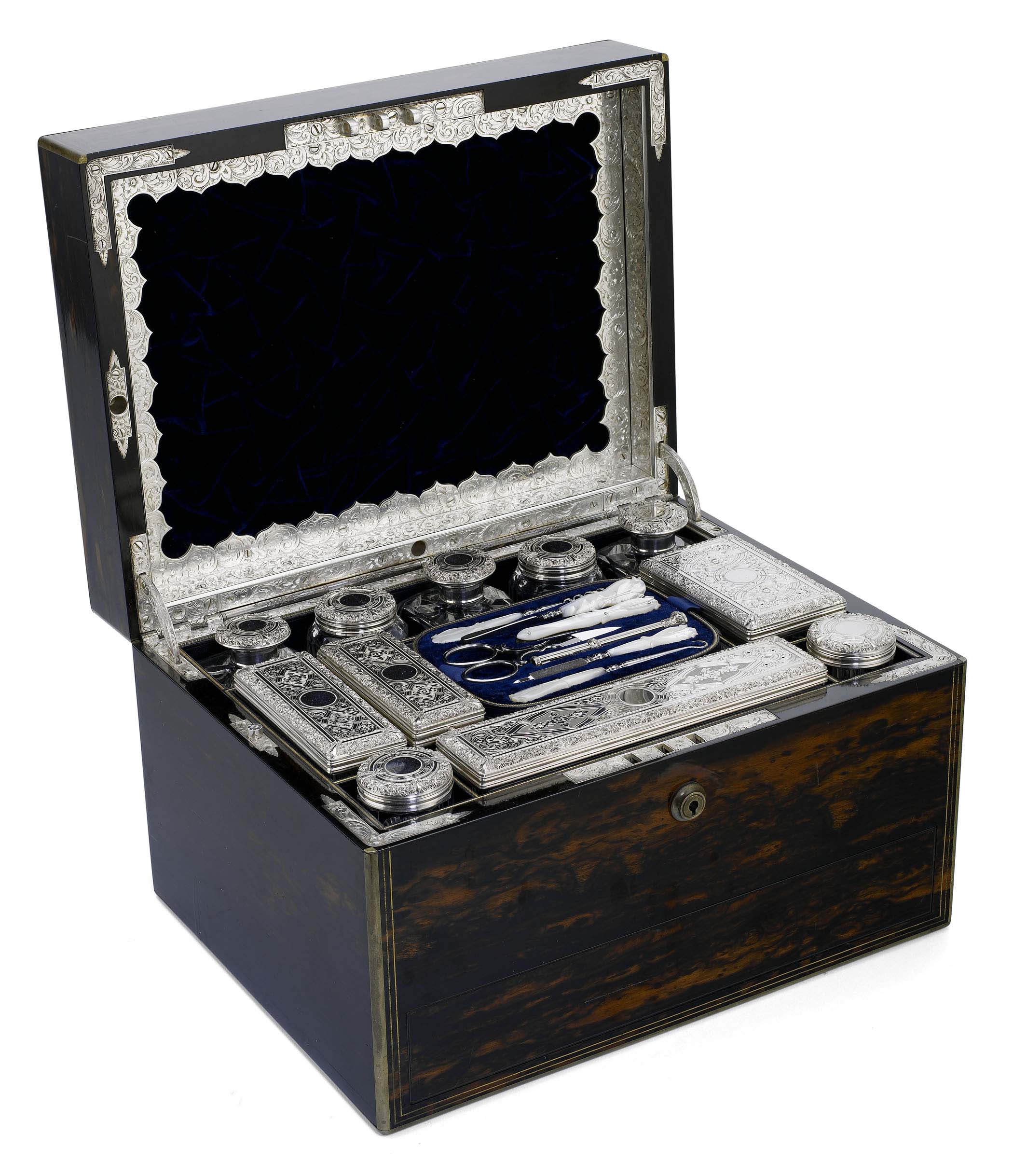 A Victorian coromandel dressing case with silver mounted fittings