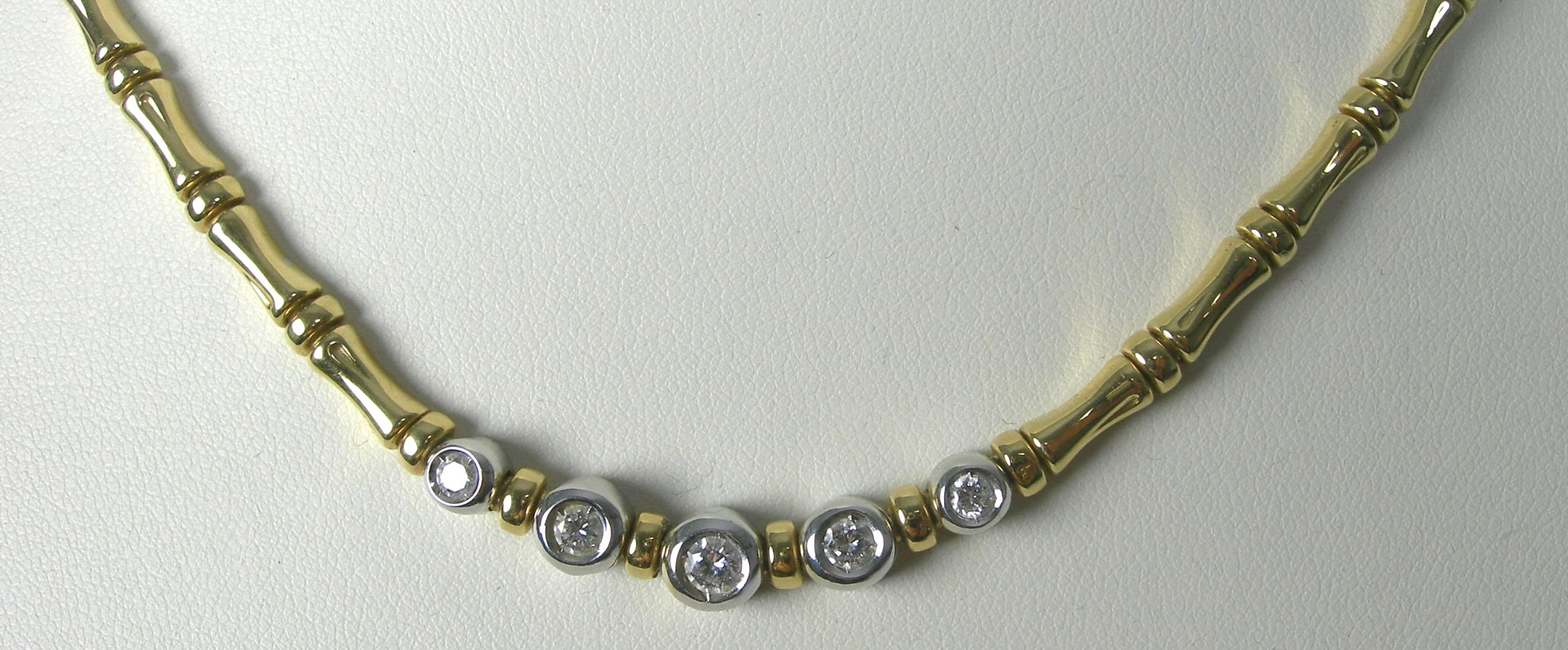 A modern 18ct two-coloured gold mounted diamond necklace,