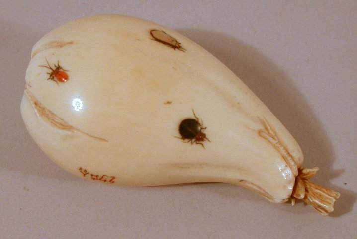 A Japanese carved ivory shibyama decorated pear shaped bean