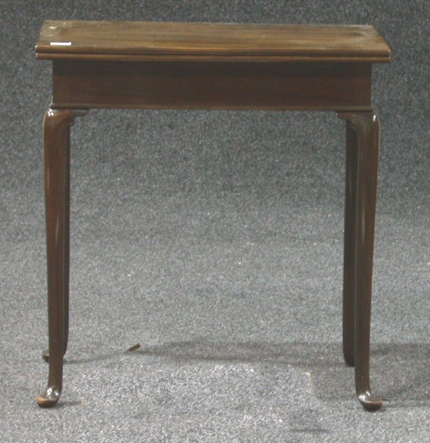 A mahogany turnover tea table,