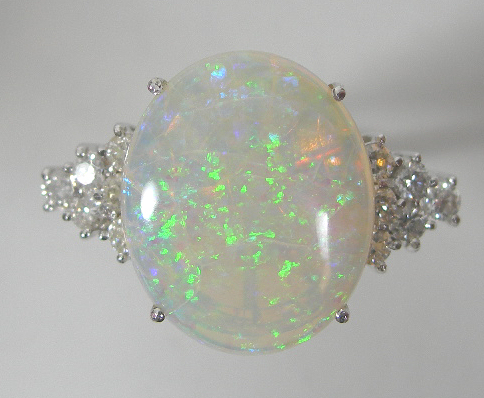 An 18ct gold mounted opal and diamond set cocktail ring,