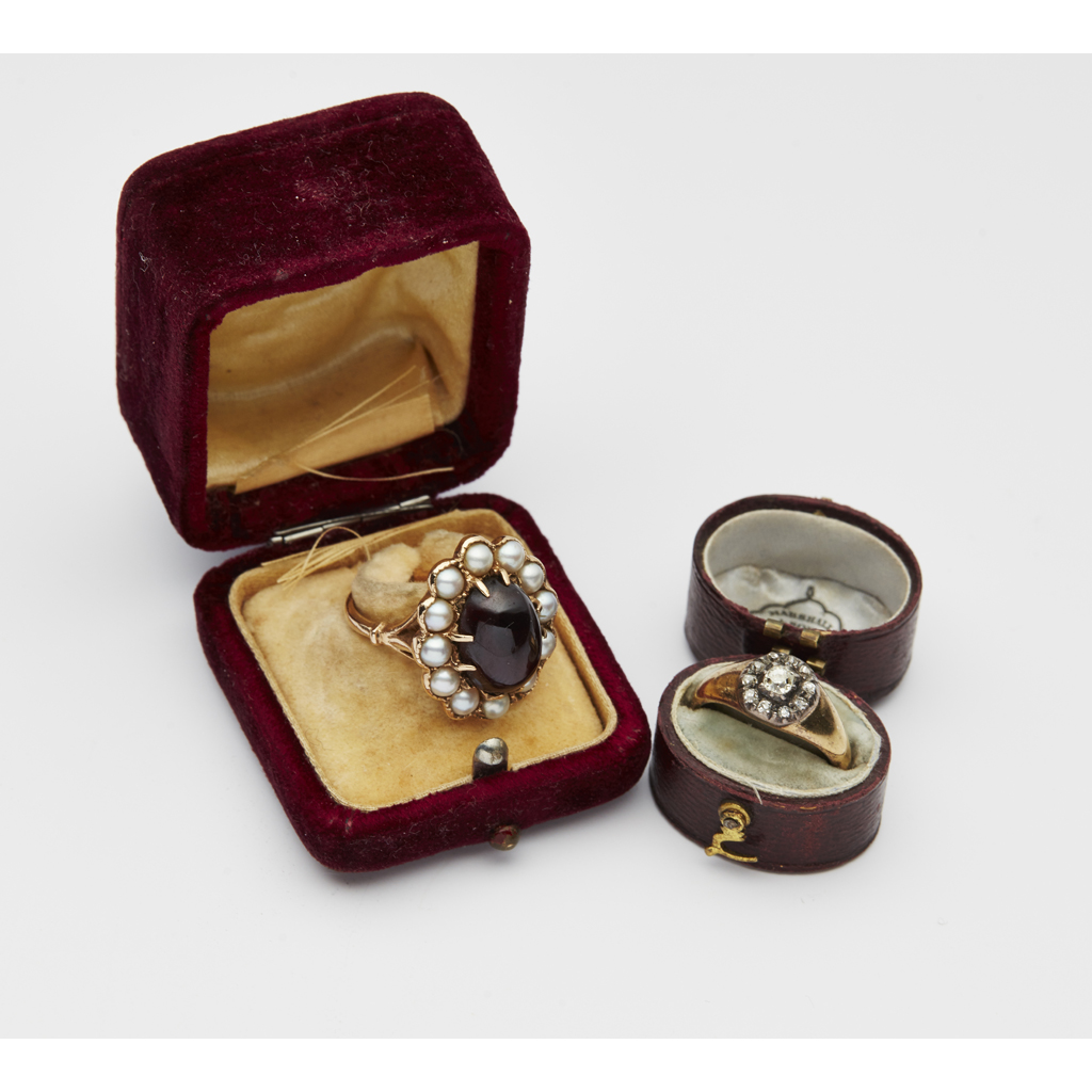 A garnet and pearl set cluster ring