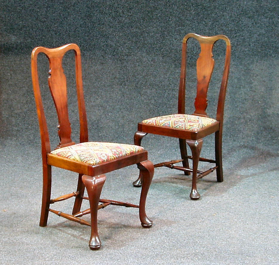 A set of six George II style dining chairs