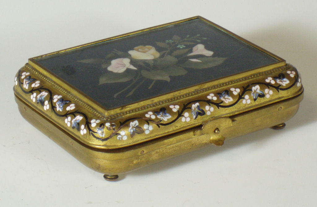 A 19th century Continental gilt metal, champleve enamel and pietra dura neccessaire