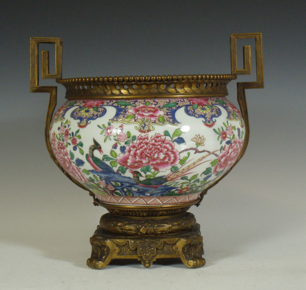 A porcelain and brass mounted urn In the Chinese 18th century style