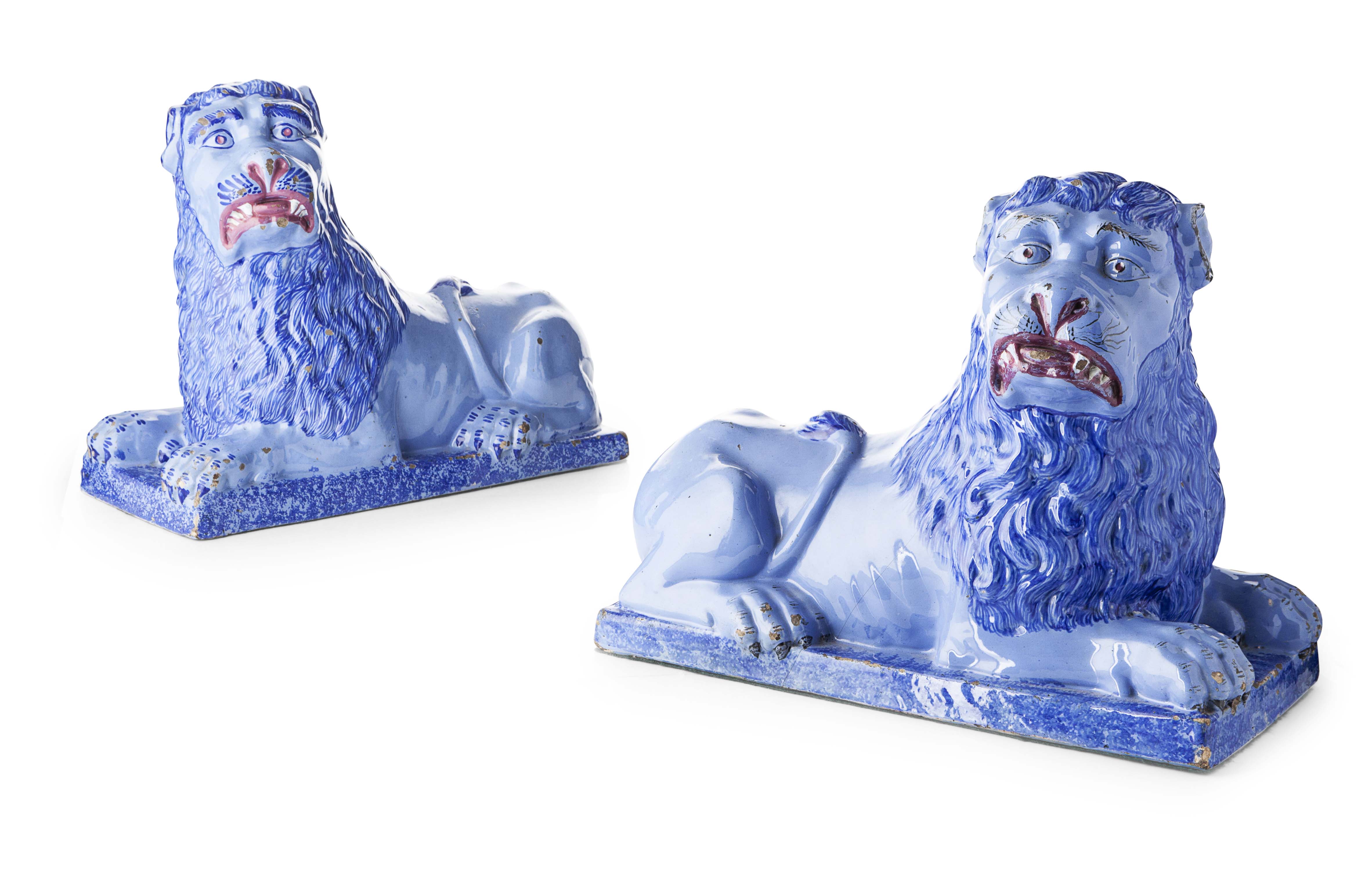 PAIR OF LARGE FRENCH FAIENCE FIGURES OF RECUMBENT LIONS