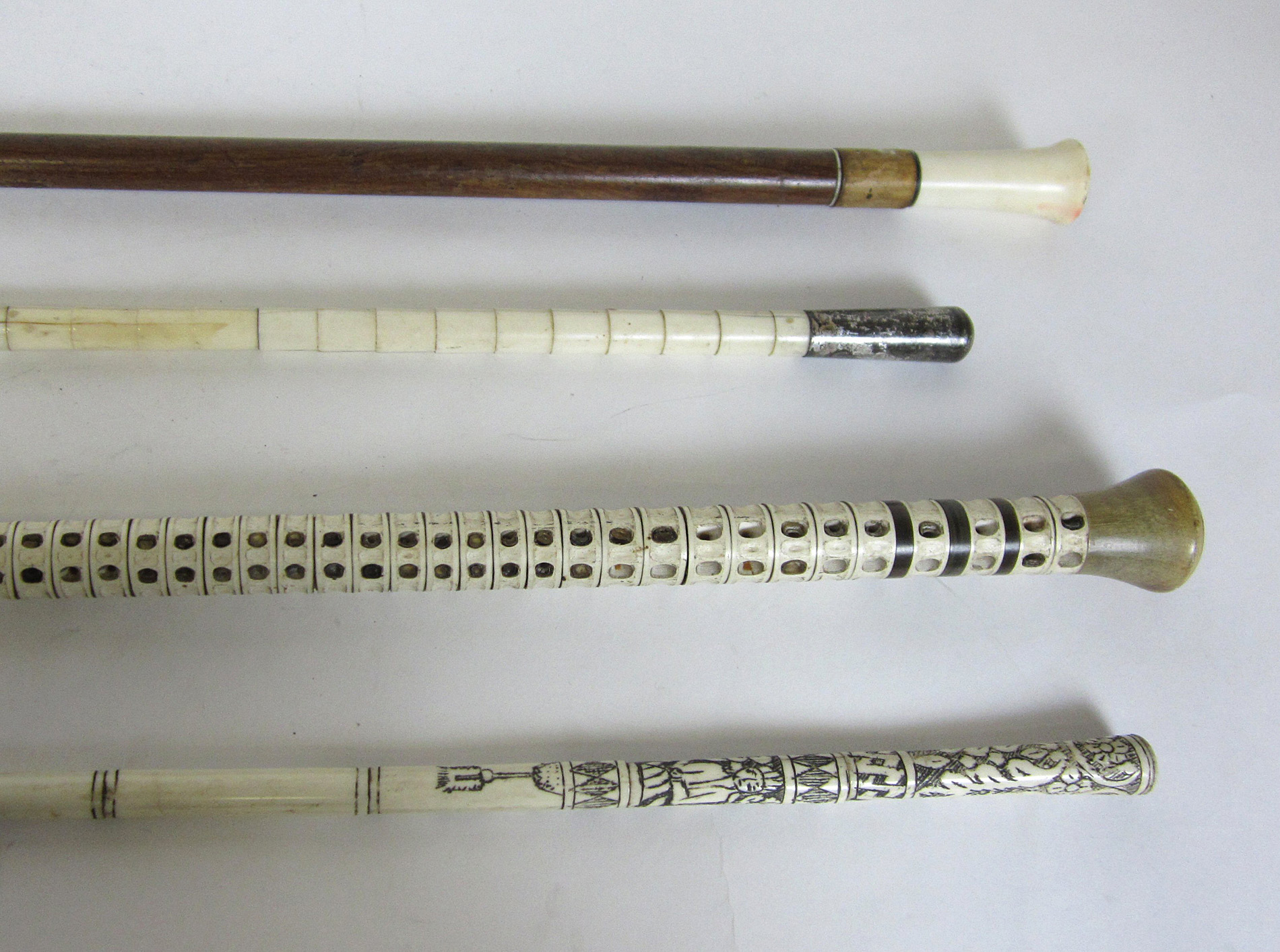 TWO IVORY WALKING CANES
