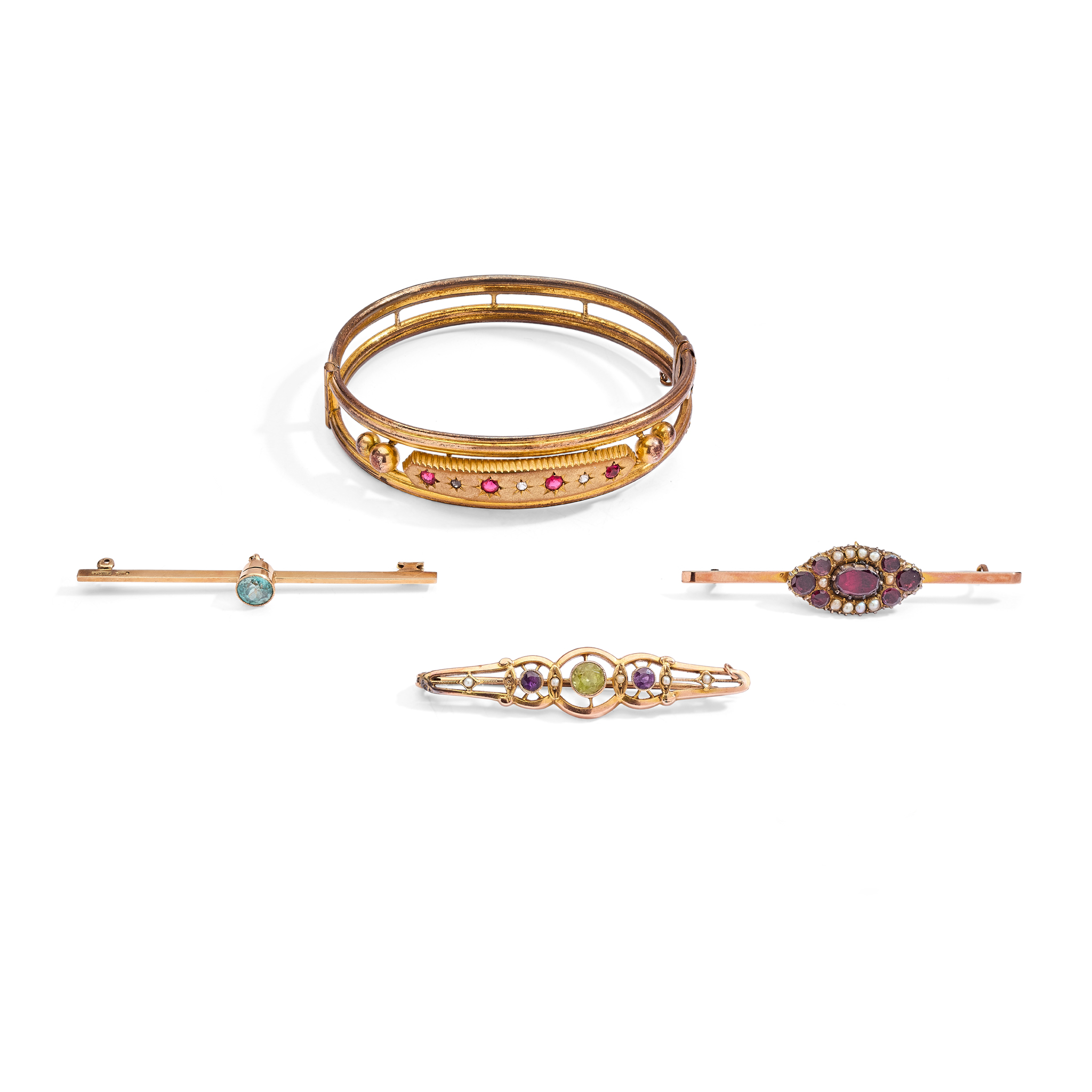A collection of three brooches and a bangle