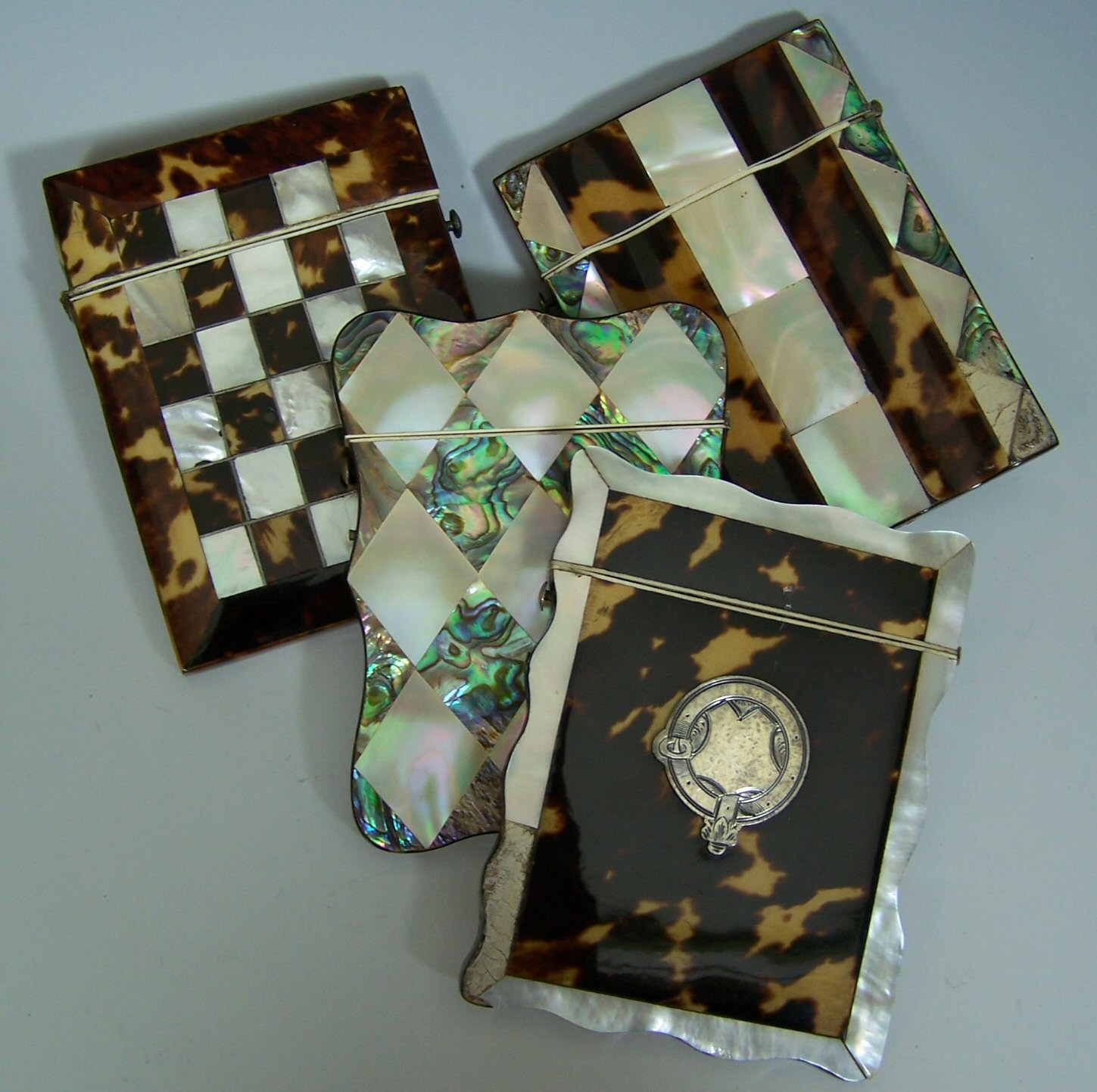A scalloped edge, mother of pearl and abalone card case,