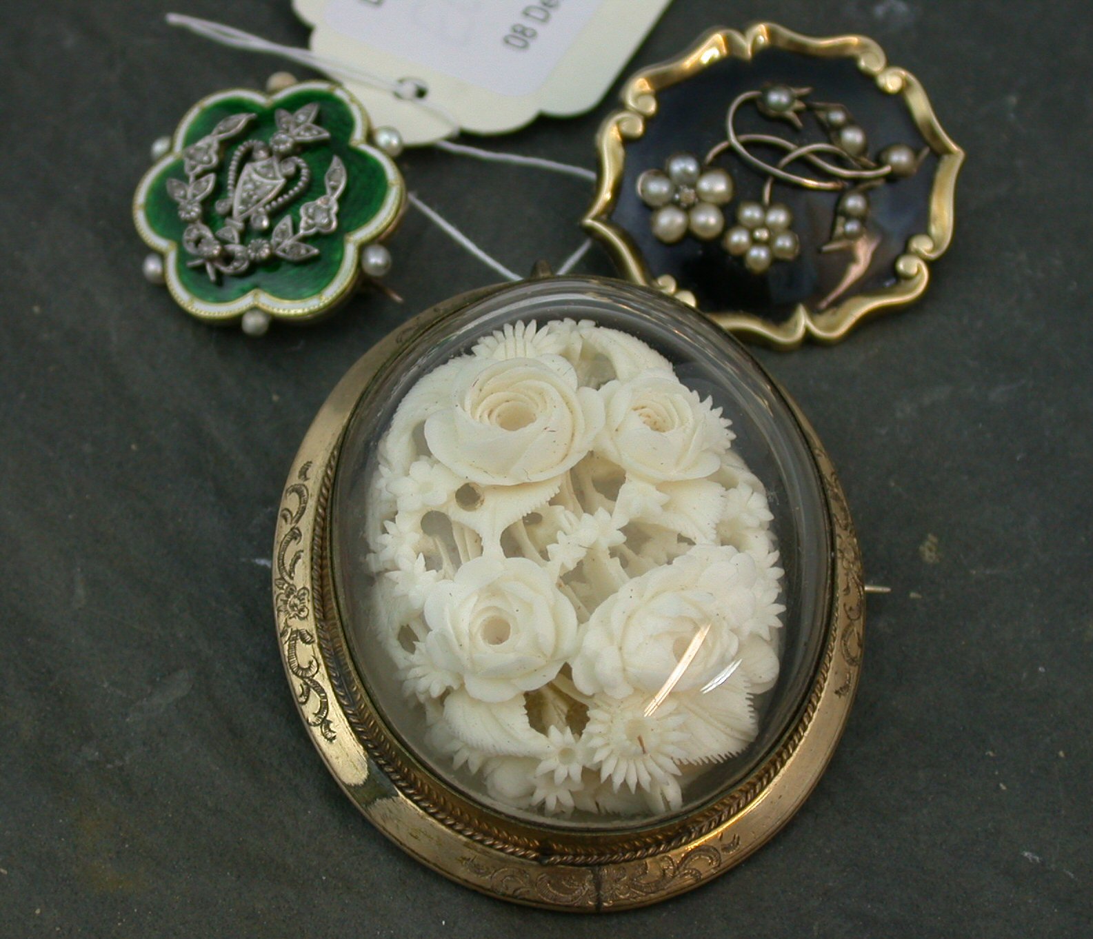 A Victorian gold mounted diamond and enamel decorated brooch,