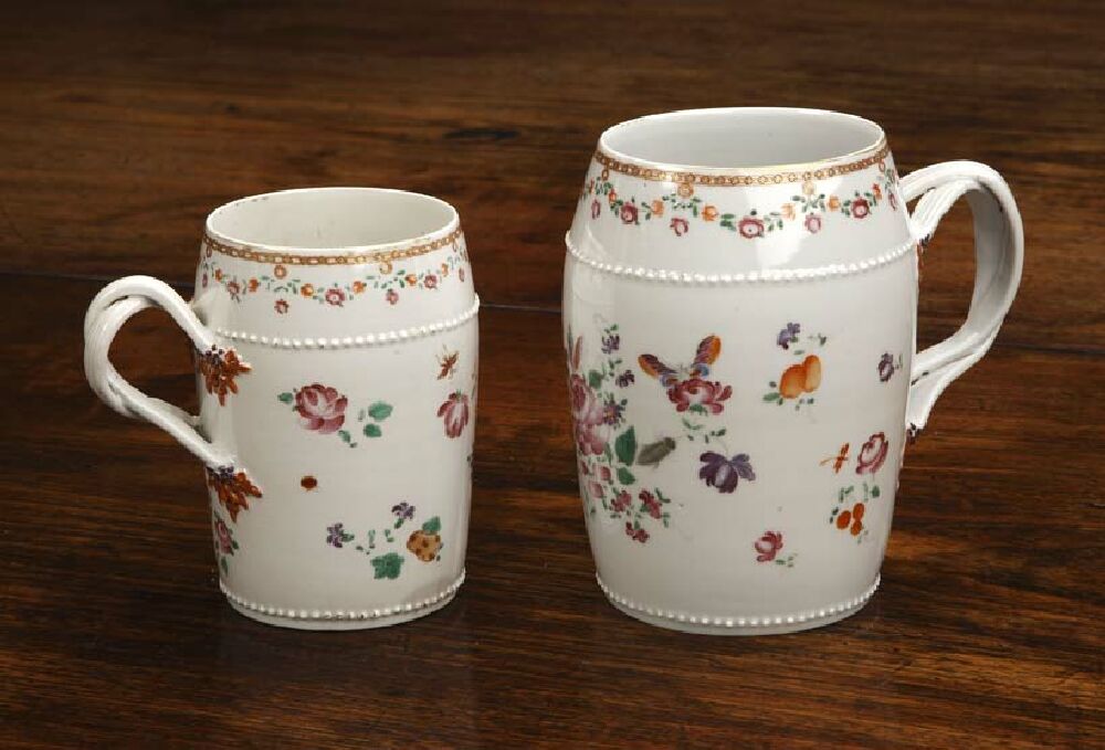 A graduated pair of early 19th century Chinese famille rose tankards