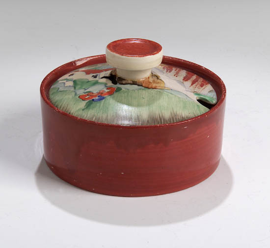 A Clarice Cliff preserve jar and cover