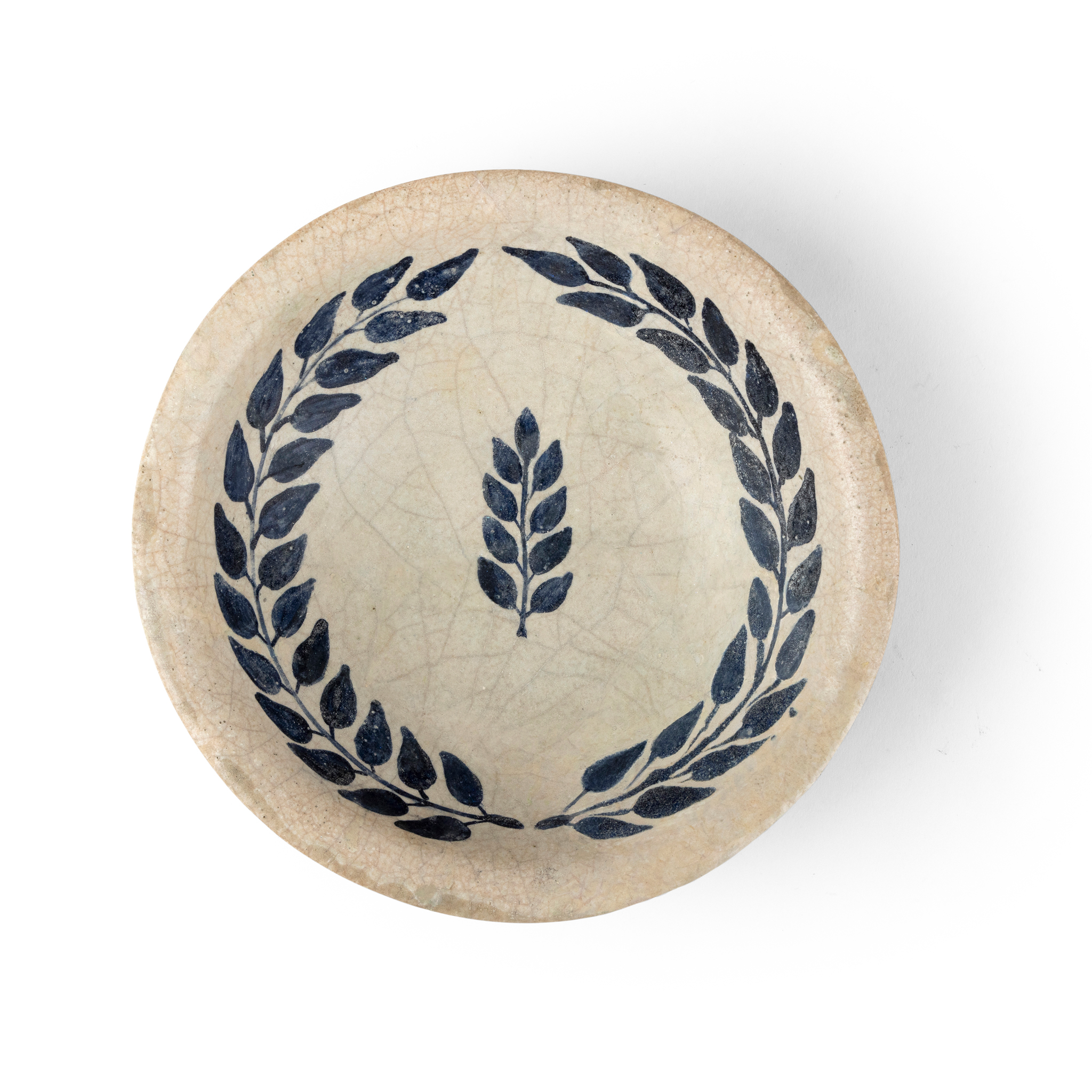 AN ABBASID TIN-GLAZED POTTERY BOWL