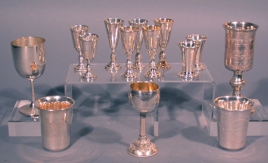 A collection of assorted silver goblets