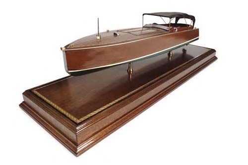 A wooden model of a motor launch,