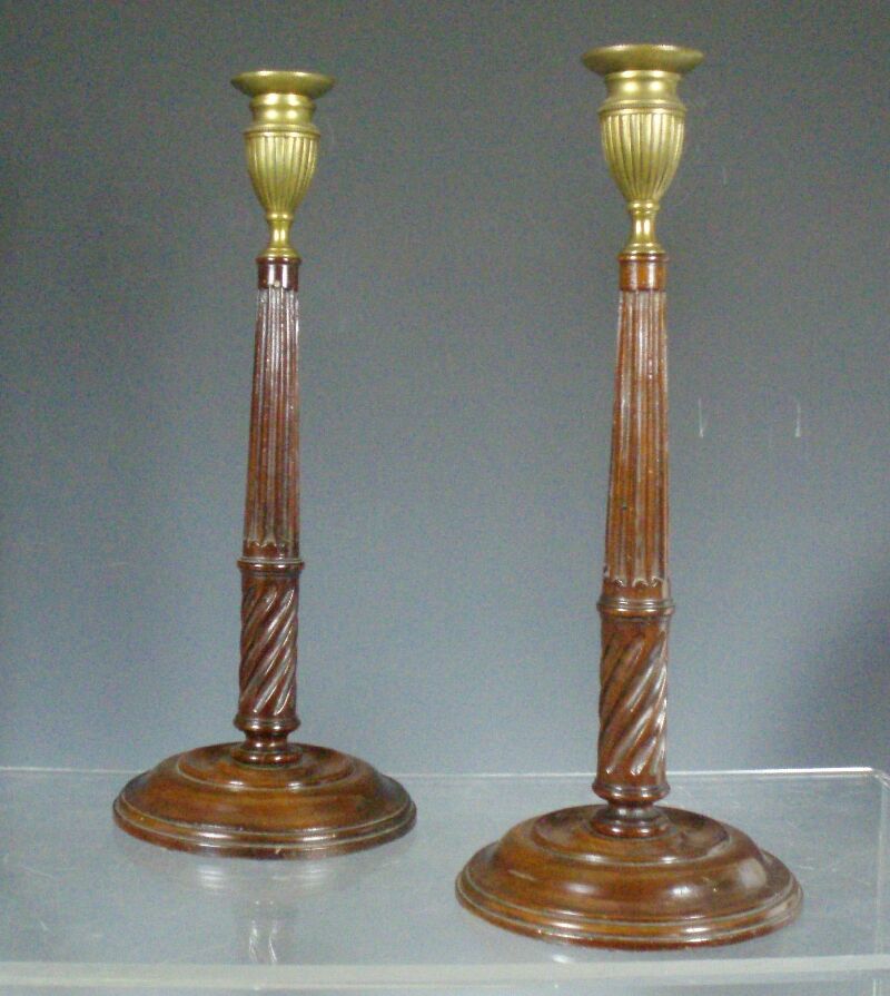 A pair of Regency brass and mahogany candlesticks