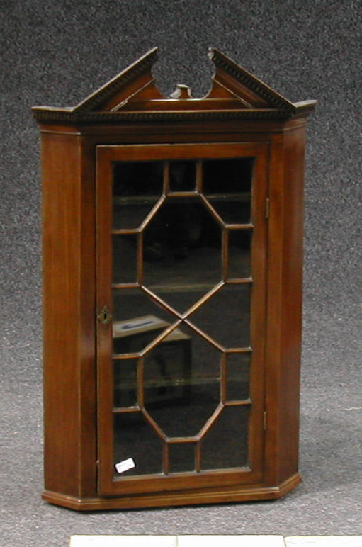 A Georgian style mahogany corner cabinet,