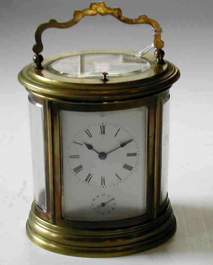 A brass cased repeating alarm carriage clock,