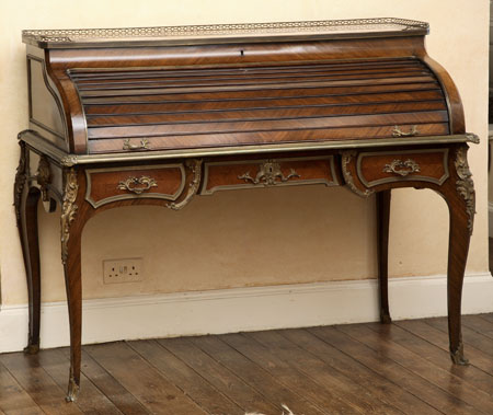 A late 19th century French marble topped, brass mounted kingwood bureau a cylindre