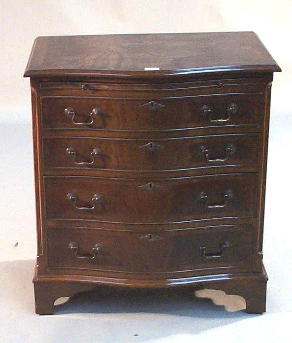 A mahogany serpentine batchelors chest