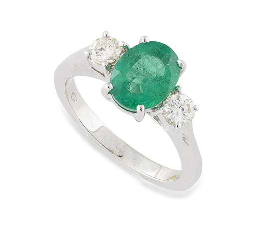 An 18ct white gold mounted emerald and diamond set ring