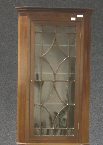 A mahogany corner cabinet,